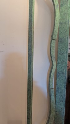 Lot 35 - An iron-verdigris-finished wall mirror