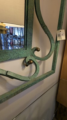 Lot 35 - An iron-verdigris-finished wall mirror