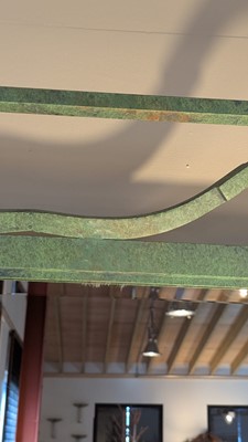 Lot 35 - An iron-verdigris-finished wall mirror