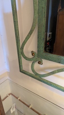Lot 35 - An iron-verdigris-finished wall mirror