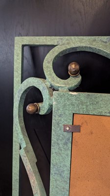 Lot 35 - An iron-verdigris-finished wall mirror