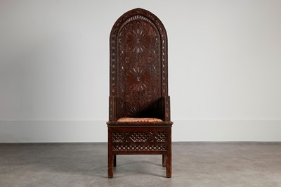 Lot 387 - A carved wood throne chair