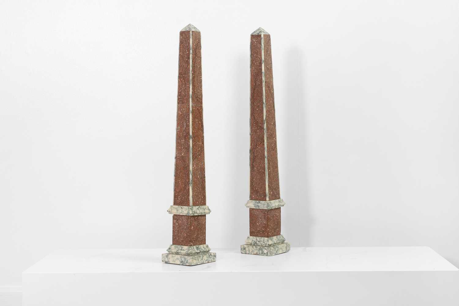 Lot 357 - A pair of grand tour porphyry and white marble obelisks