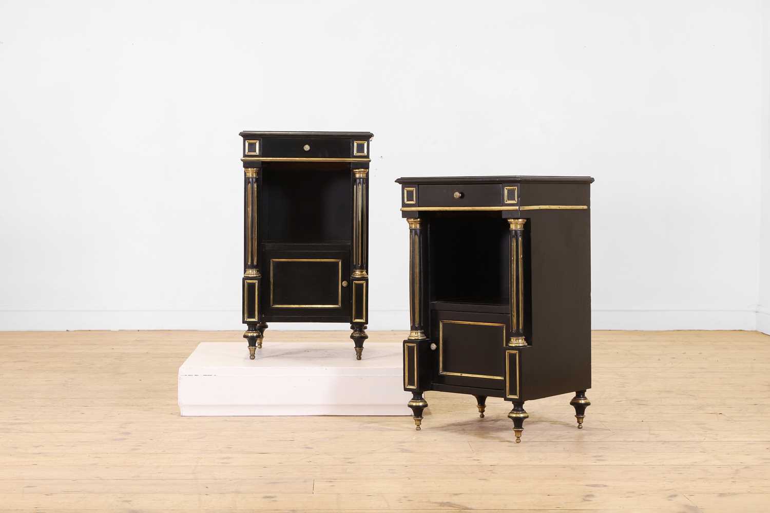 Lot 42 - A pair of Directoire-style ebonised bedside cabinets