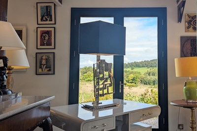 Lot 231 - A sculpted-steel table lamp