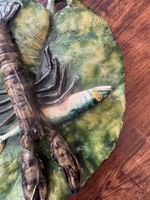 Lot 185 - A Palissy ware shaped plaque