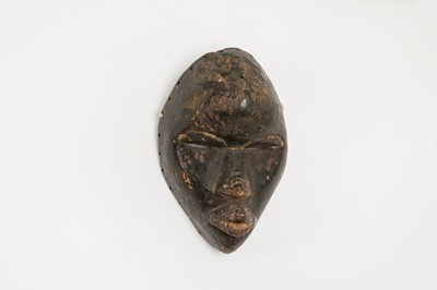 Lot 108 - A carved wood mask