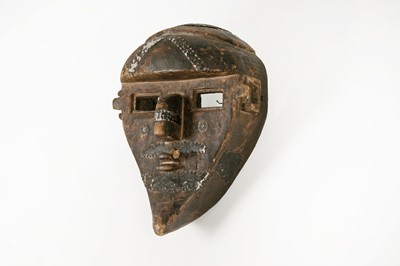 Lot 391 - An aluminium-bound carved wood mask