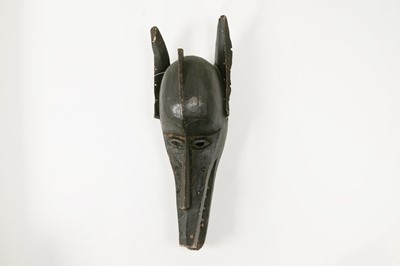 Lot 242 - A carved mask