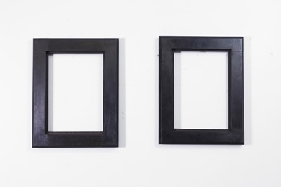 Lot 563 - A pair of ebony and specimen stone frames