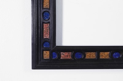 Lot 563 - A pair of ebony and specimen stone frames