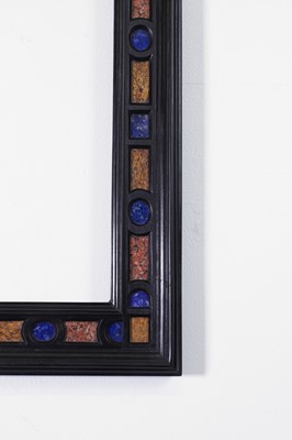 Lot 563 - A pair of ebony and specimen stone frames