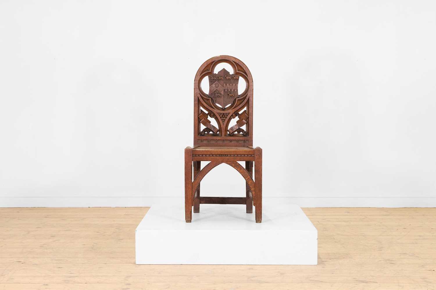 Lot 518 - A Victorian Gothic Revival oak hall chair