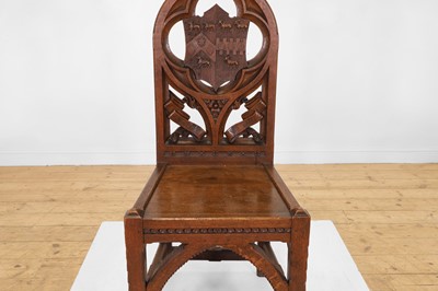 Lot 518 - A Victorian Gothic Revival oak hall chair