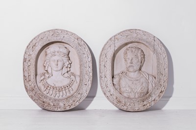 Lot 511 - A pair of Roman-style carved wooden portrait plaques