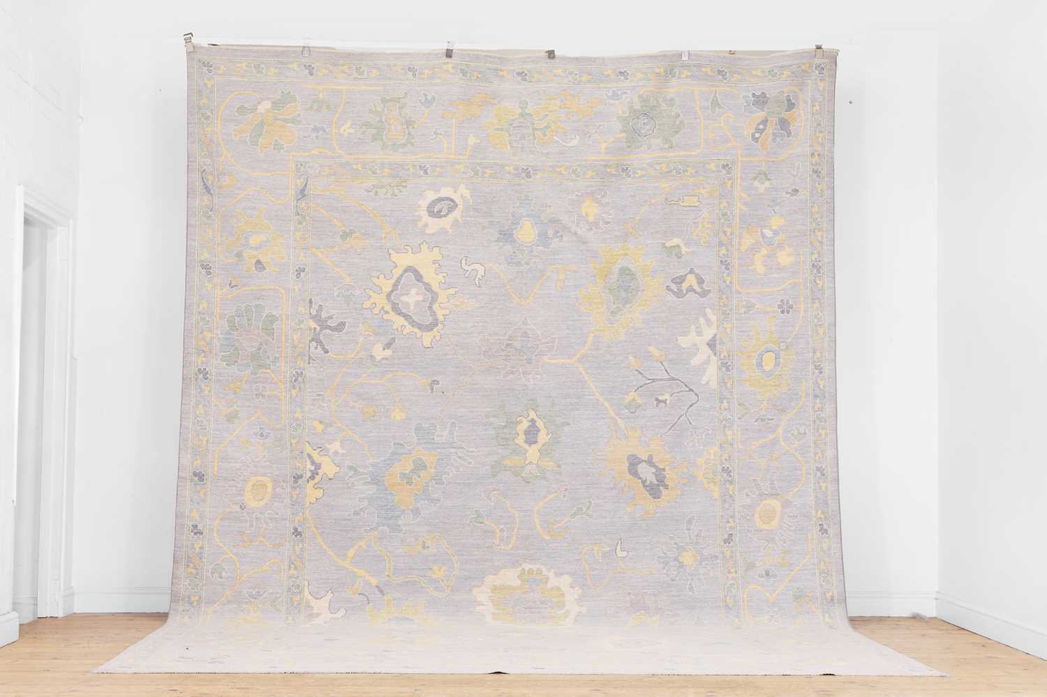 Lot 51 - A large Oushak wool carpet