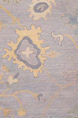 Lot 51 - A large Oushak wool carpet