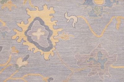 Lot 51 - A large Oushak wool carpet