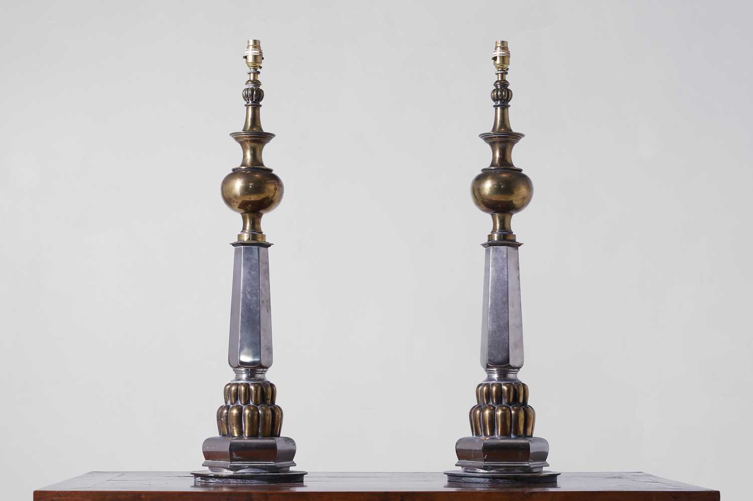 Lot 474 - A pair of large polished brass and steel table lamps