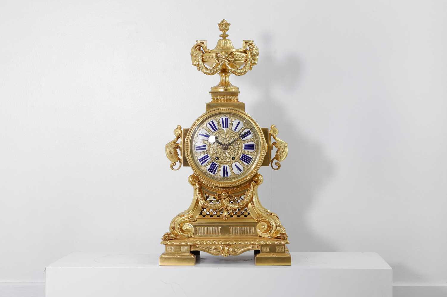 Lot 204 - A Louis XIV-style gilt-bronze mantel clock
