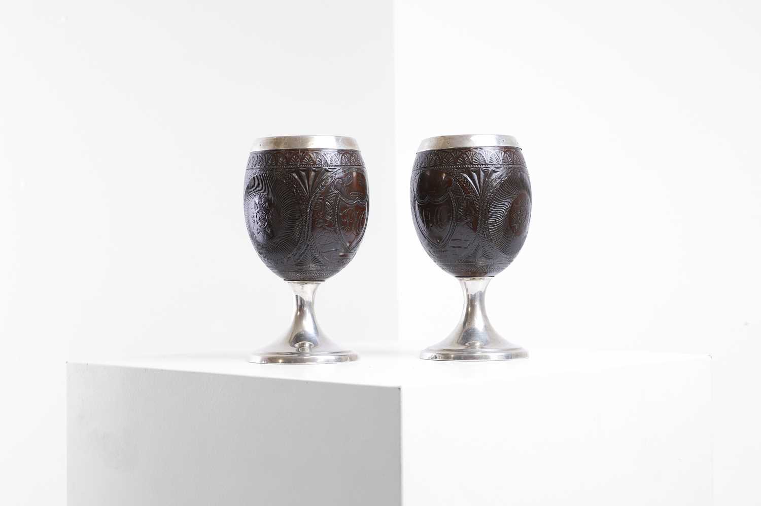 Lot 37 - A pair of George III silver-mounted coconut cups