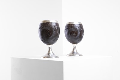 Lot 37 - A pair of George III silver-mounted coconut cups