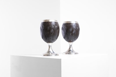 Lot 37 - A pair of George III silver-mounted coconut cups