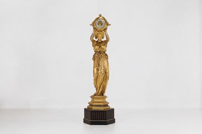 Lot A large gilt-metal figural clock