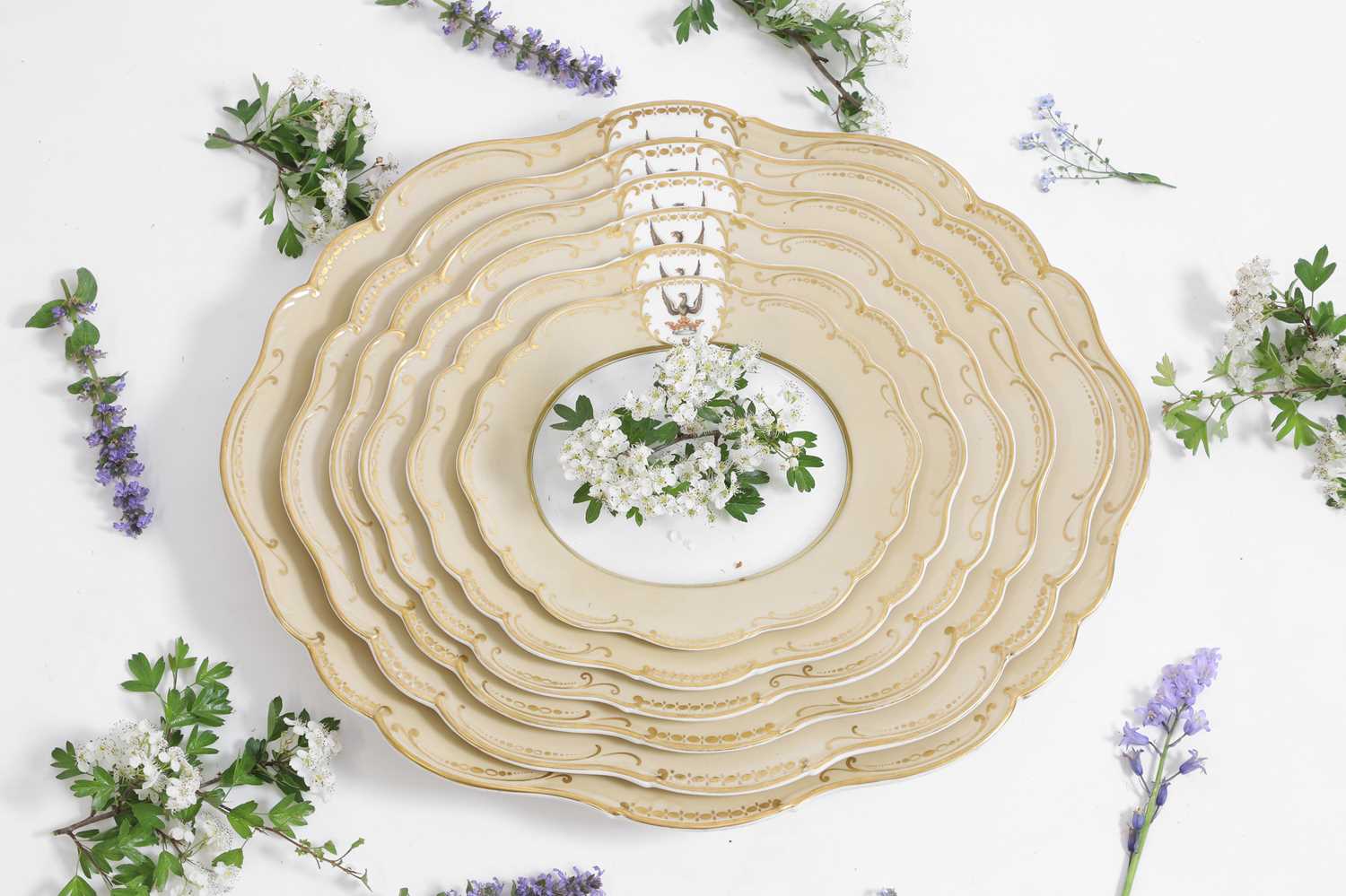 Lot 52 - A set of Victorian graduated porcelain armorial plates
