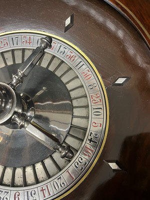 Lot 50 - A cased rosewood and brass-inlaid roulette wheel