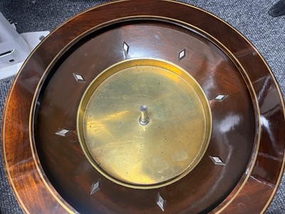 Lot 50 - A cased rosewood and brass-inlaid roulette wheel