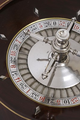 Lot 50 - A cased rosewood and brass-inlaid roulette wheel