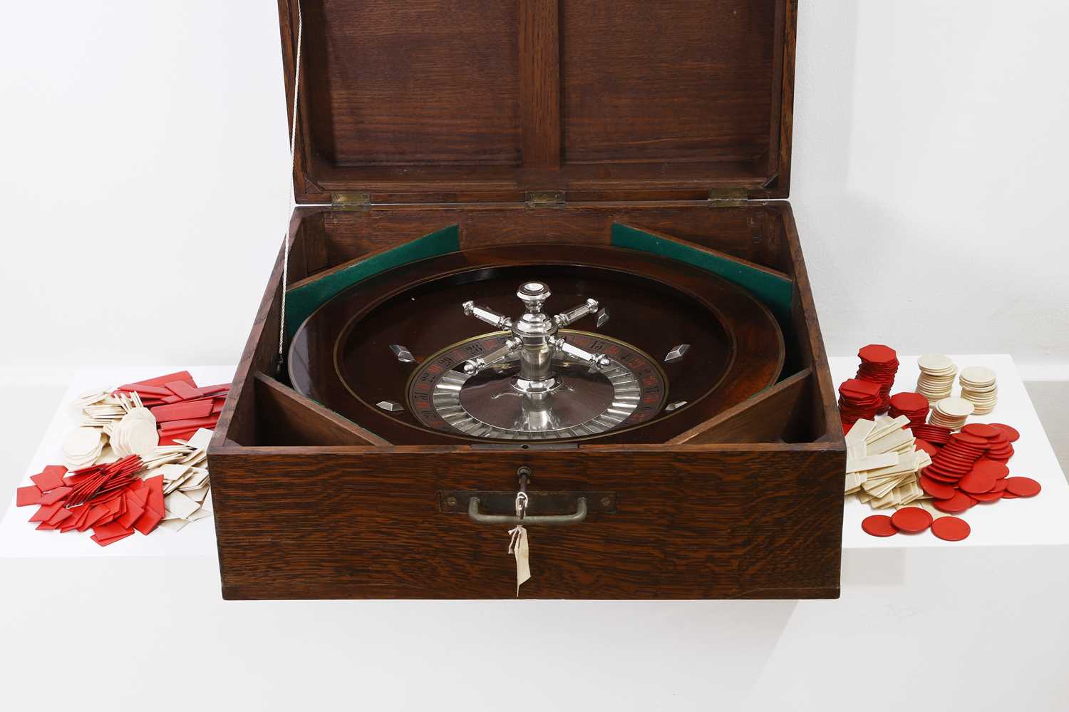 Lot 50 - A cased rosewood and brass-inlaid roulette wheel