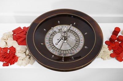 Lot 50 - A cased rosewood and brass-inlaid roulette wheel