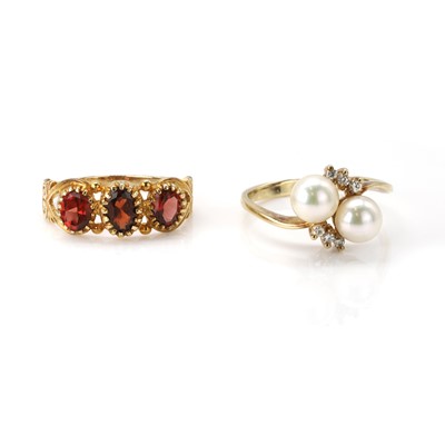 Lot 310 - A 9ct gold pearl and diamond ring and a 9ct gold garnet ring