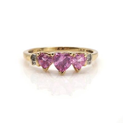 Lot 114 - A rose gold pink sapphire and diamond ring