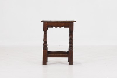 Lot 39 - A carved oak joint stool