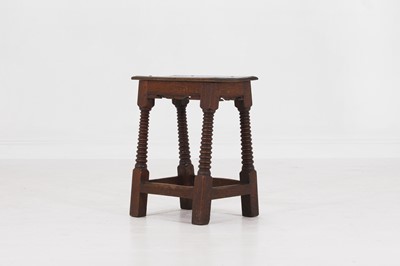 Lot 39 - A carved oak joint stool