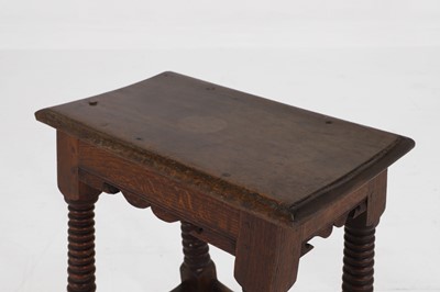 Lot 39 - A carved oak joint stool