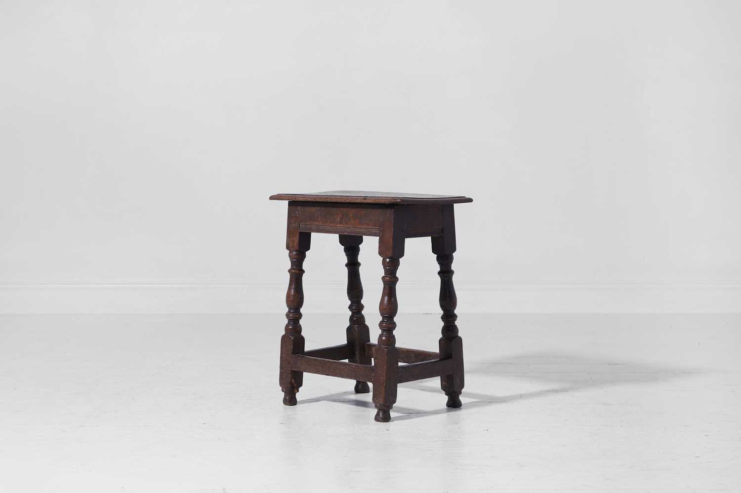 Lot 25 - An oak joint stool