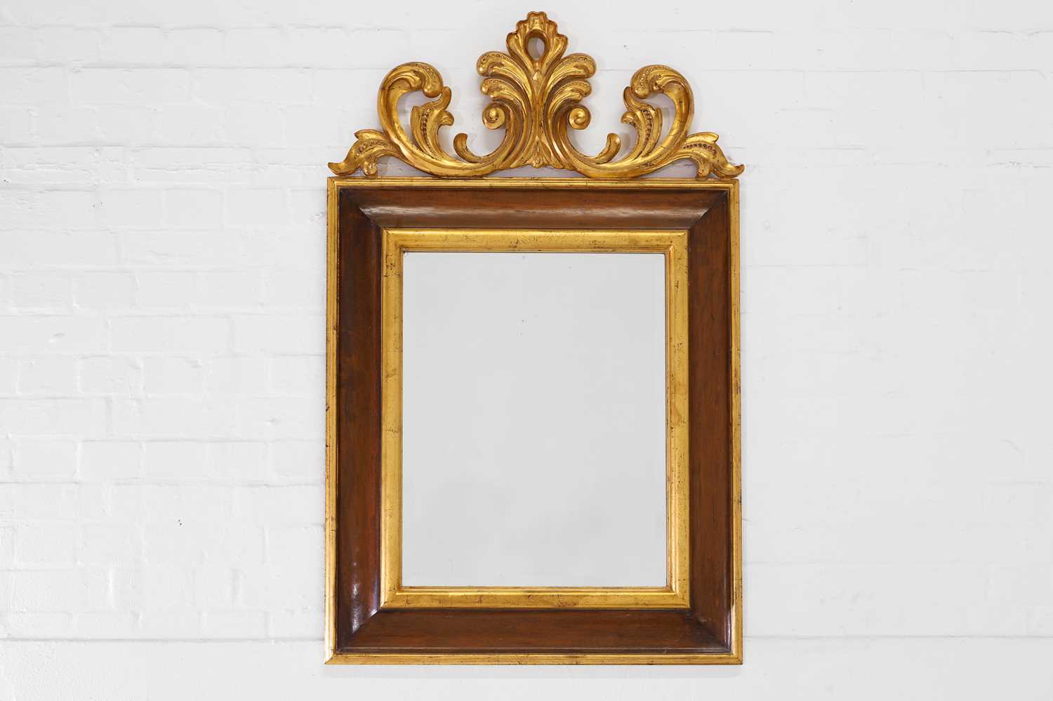 Lot 1 - A baroque-style walnut and parcel-gilt pier mirror