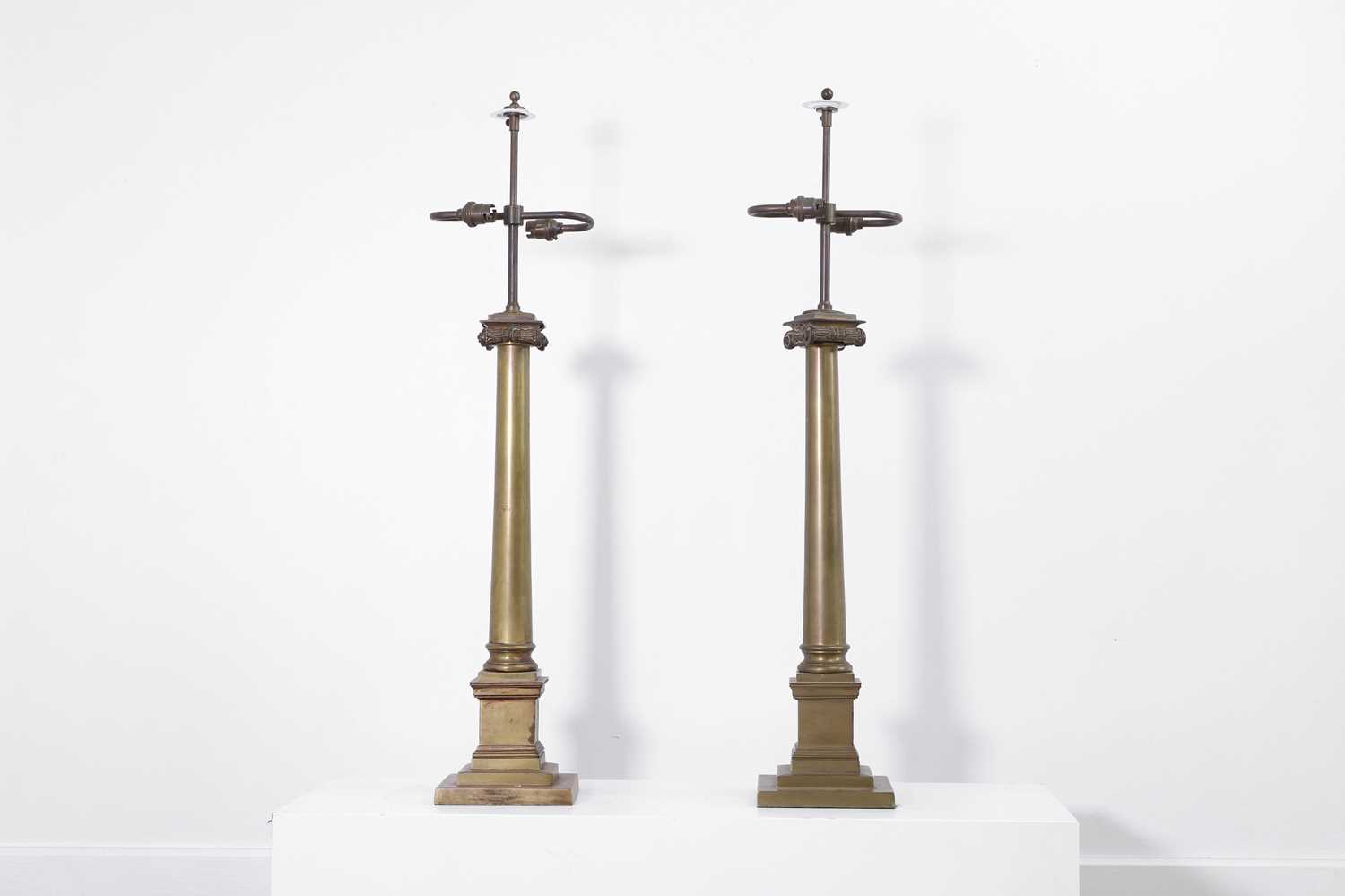Lot 10 - A pair of brass column lamps