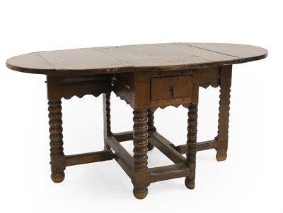 Lot 380 - An oak gateleg table