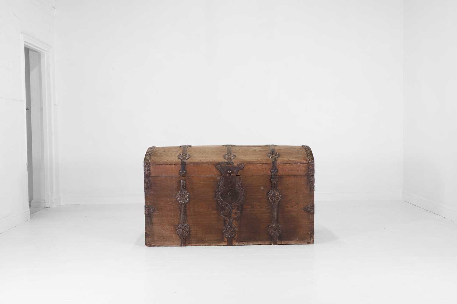 Lot 12 - An iron-bound oak chest