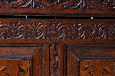 Lot 13 - A carved oak court cupboard