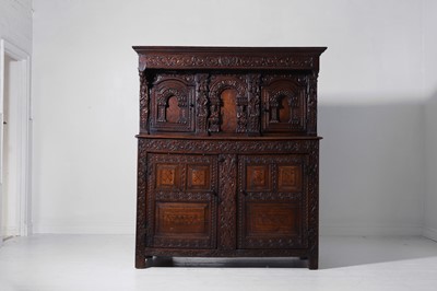 Lot 13 - A carved oak court cupboard
