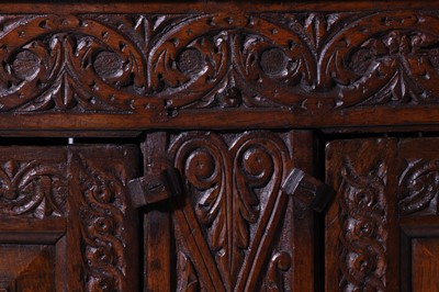 Lot 13 - A carved oak court cupboard