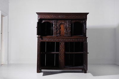 Lot 13 - A carved oak court cupboard