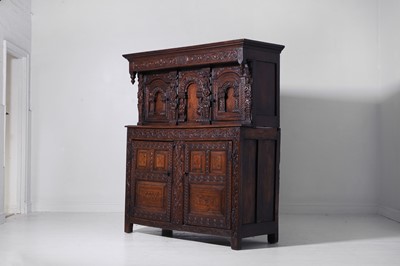 Lot 13 - A carved oak court cupboard