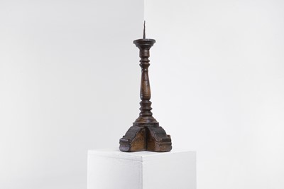 Lot 18 - A walnut pricket candlestick